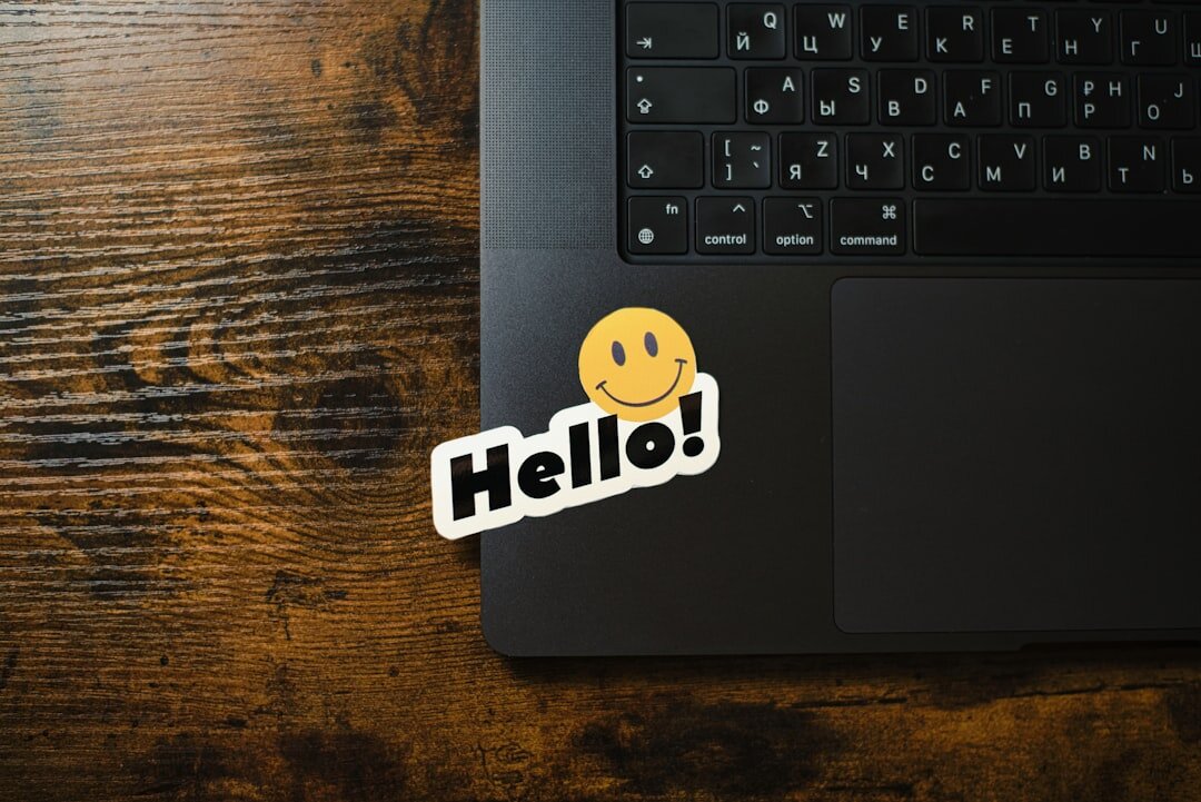 Laptop with code on screen on a wooden desk