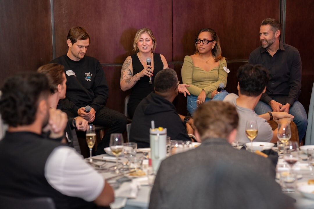 Group of professionals in a panel discussion at a conference